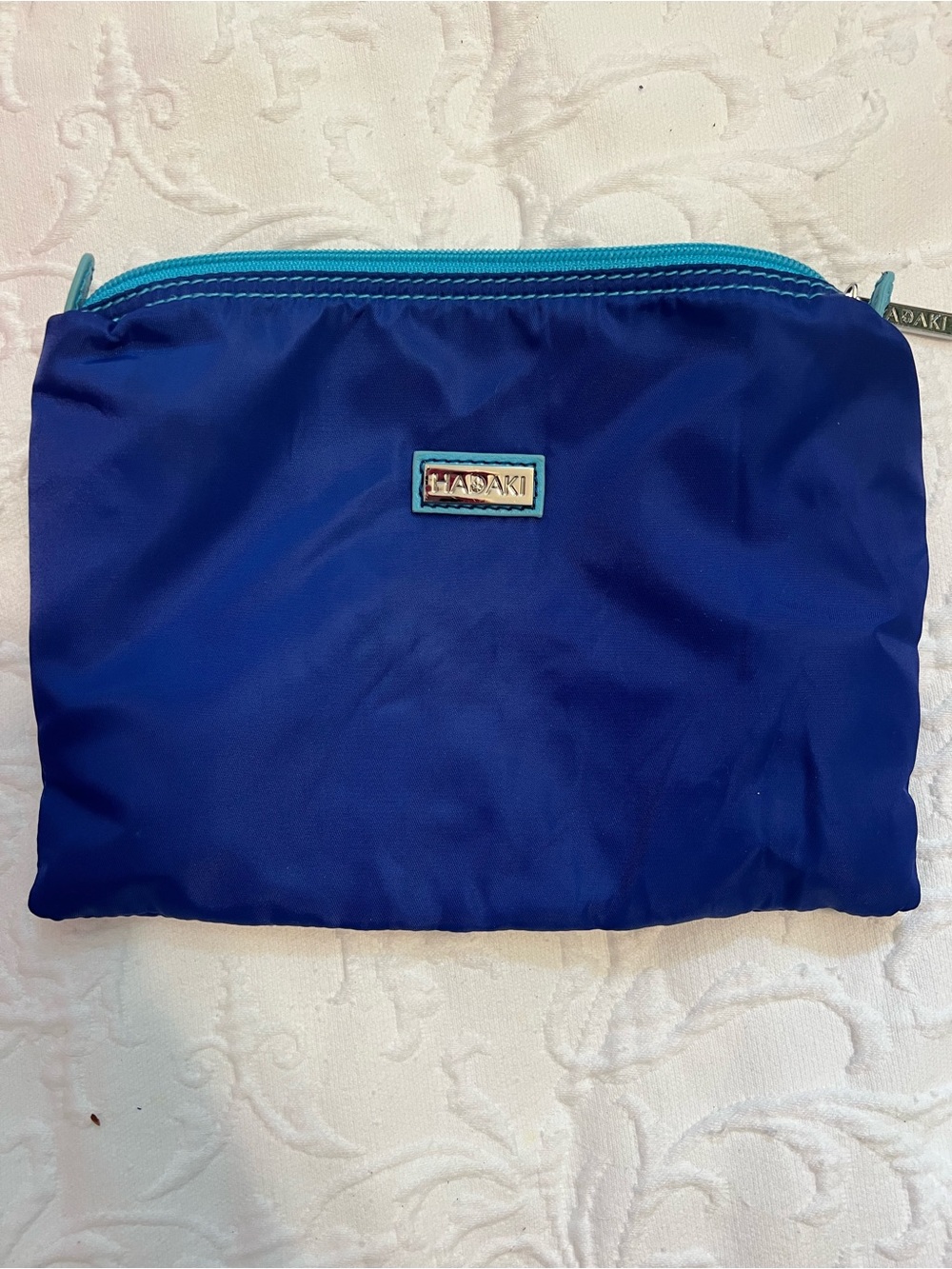 HADAKI Blue Nylon Cosmetic Pouch with Teal Trim and Striped Interior
